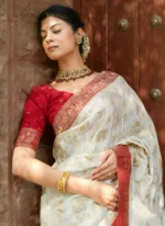 Ivory Silk Saree with Antique Red Zari Border & Royal Motif Weaving – Elegant Wedding & Festive Wear - Image 3